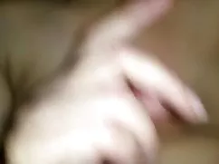 Big titted lady entertains with a dick jerking off her boobs between boobs